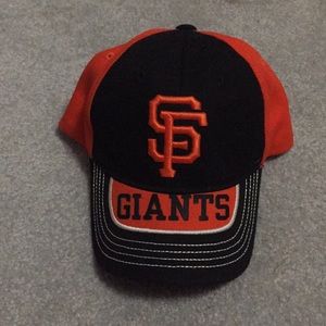 An orange and black Sanfrancisco  Giants hat